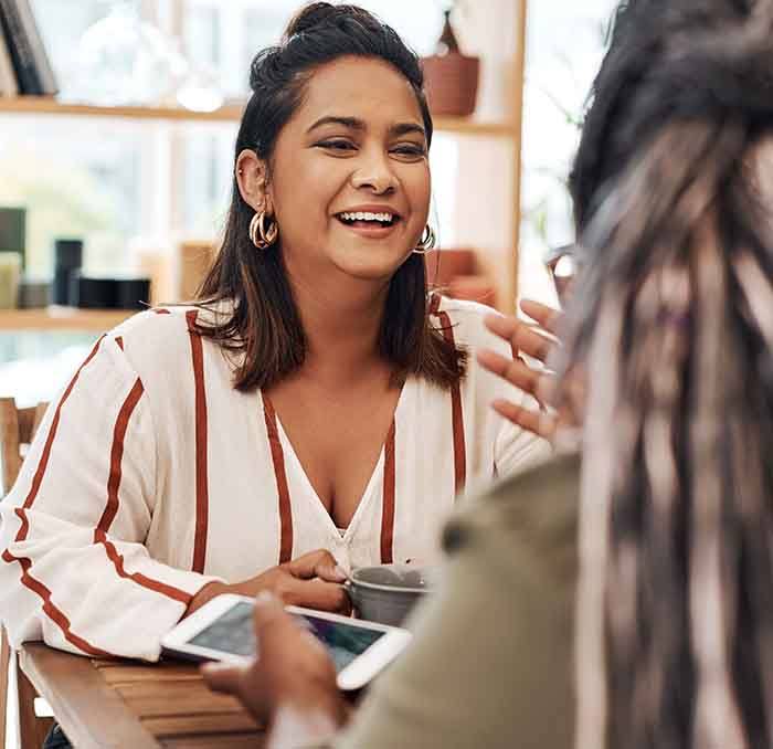 a woman having coffee with her friend